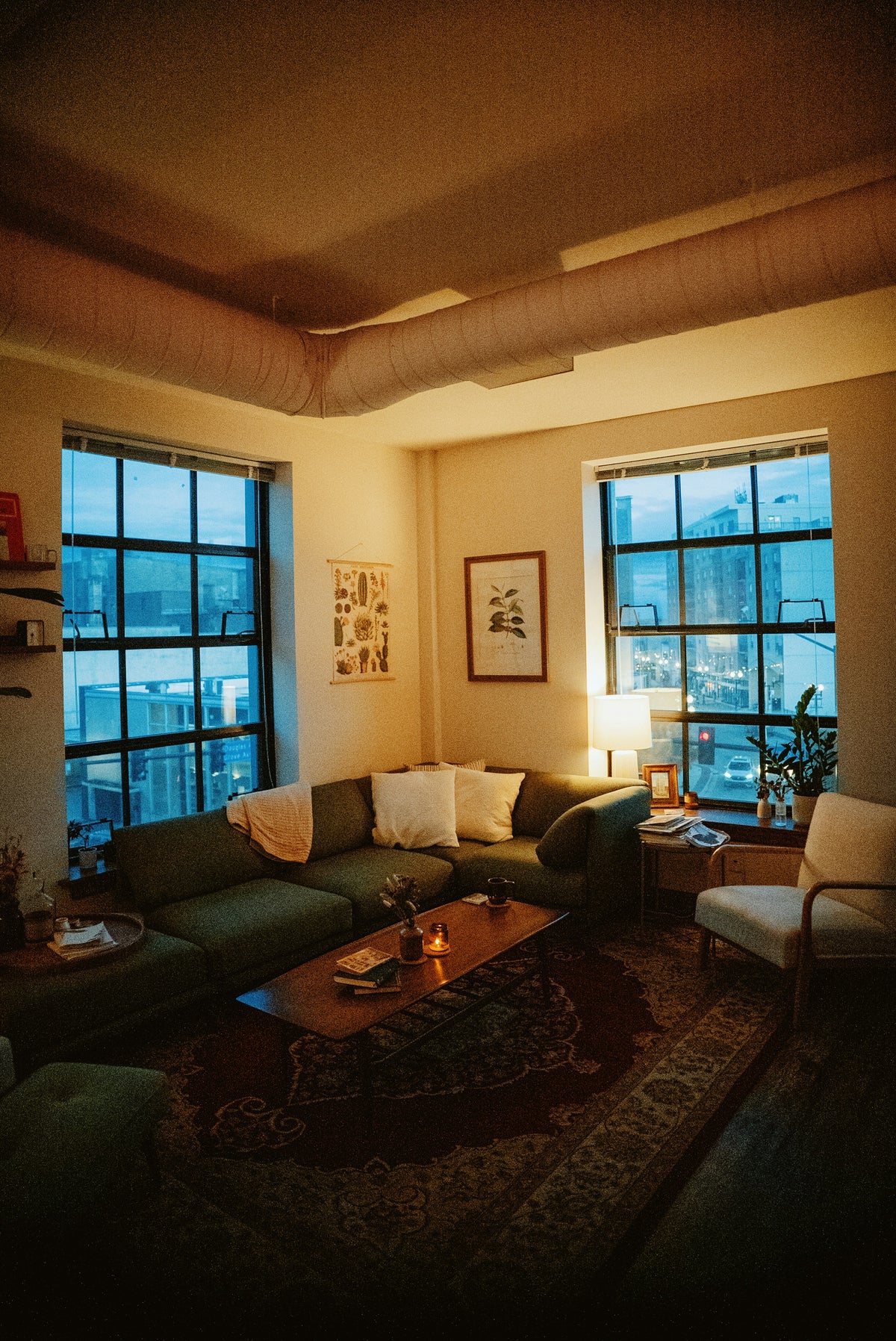Warm-lit modern living room with fireplace, Brightlifeland hero image